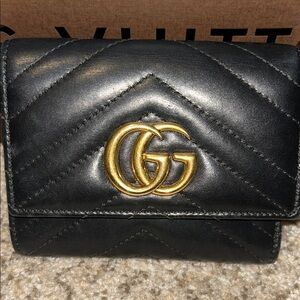 Gucci Black Leather Bag with Gold Accents